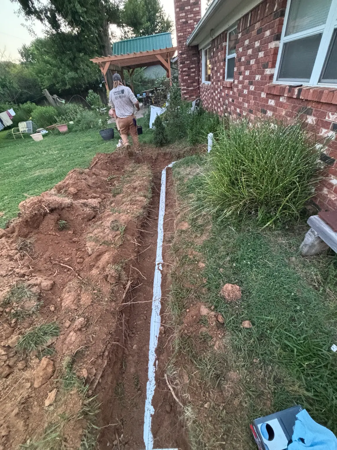 New PVC sewer line installed by United Plumbing in Rogers, Arkansas.