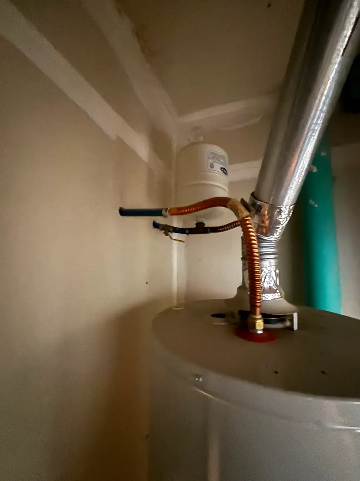 Updated water heater connections installed by United Plumbing in Fayetteville, Arkansas.