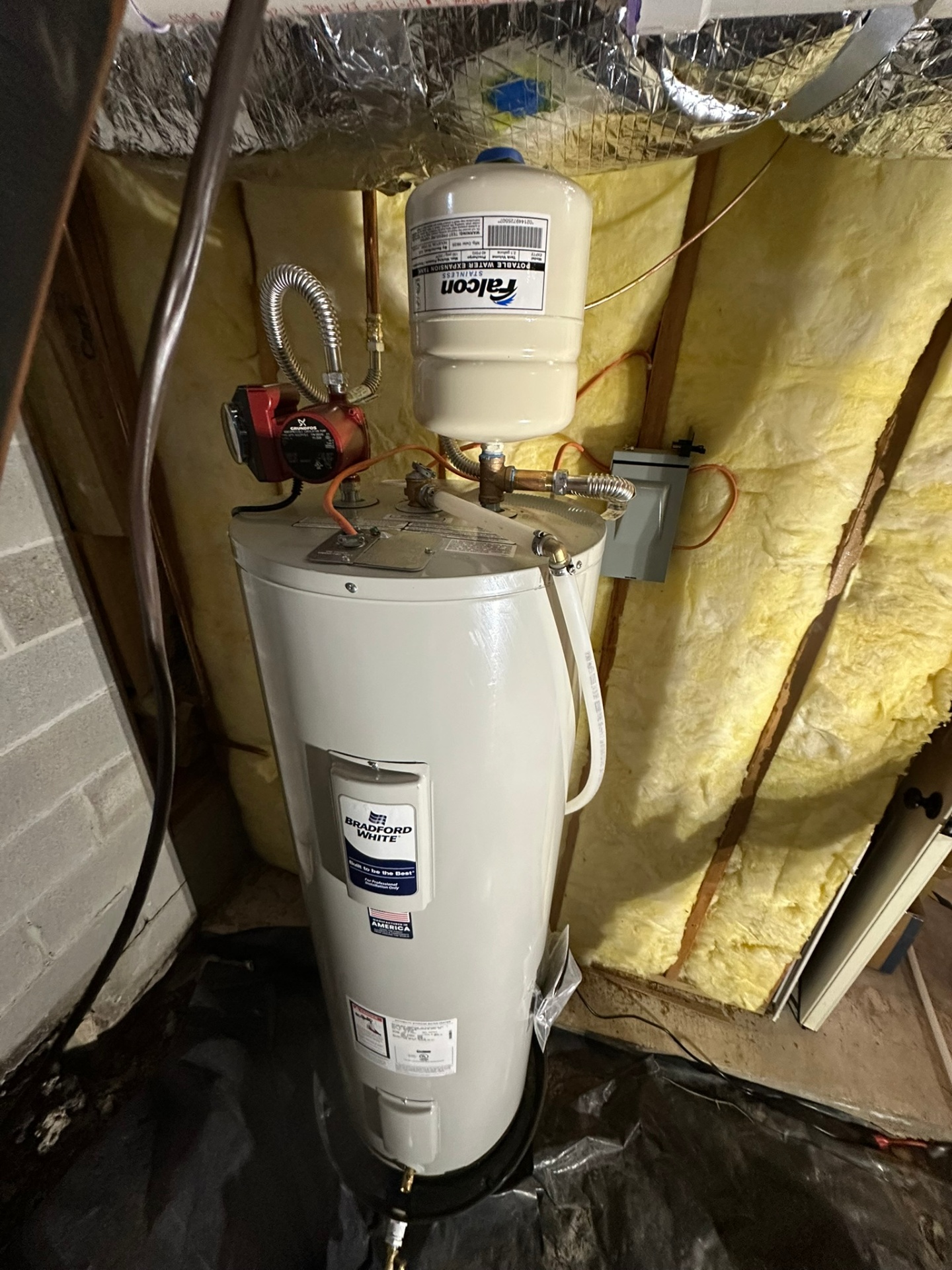 Completed 50-gallon electric water heater and hot-water comfort pump installation by United Plumbing in Bella Vista, Arkansas.
