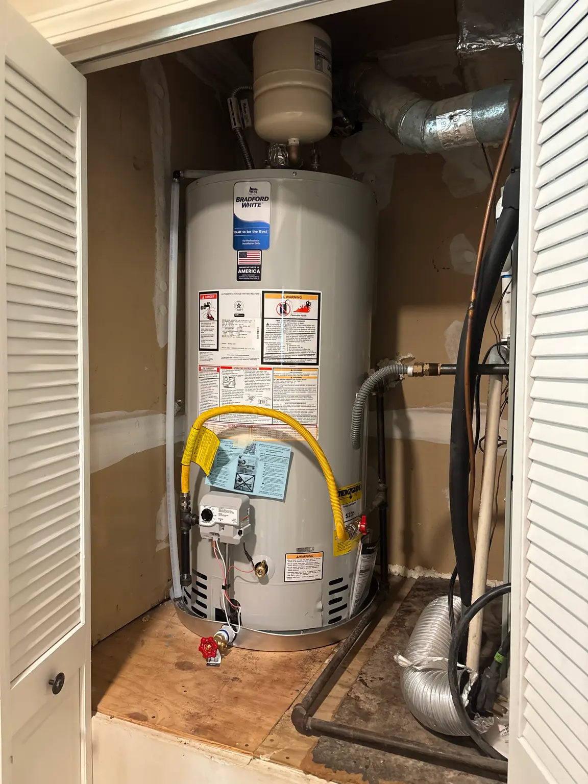New Bradford White water heater installed by United Plumbing in Fayetteville, Arkansas.