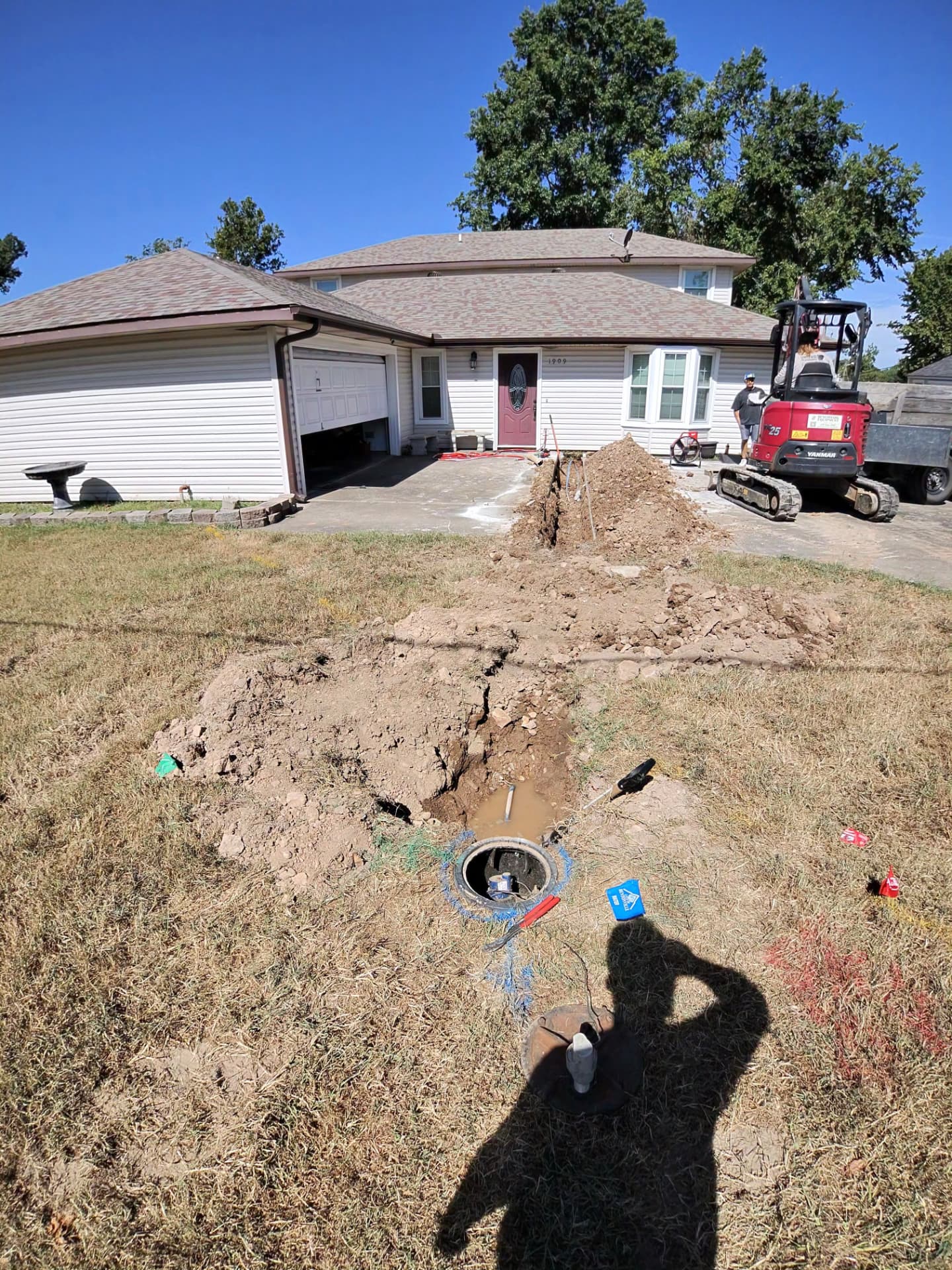 United Plumbing installing a protected residential water service line from the meter to a home in Bentonville, Arkansas.