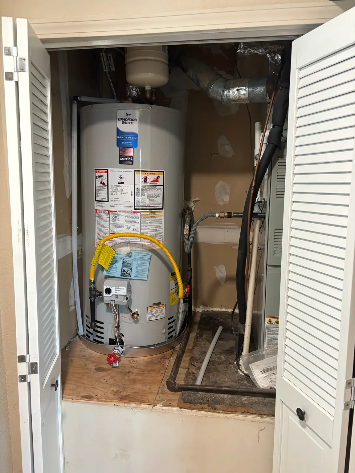 New Bradford White natural gas water heater installed by United Plumbing in Fayetteville, Arkansas.